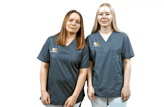 two women standing next to each other wearing scrubs with a logo on the front that says ' alzheimer ' on it