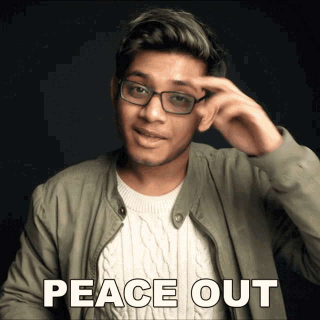 a young man wearing glasses and a green jacket says peace out