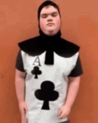 a man is wearing a playing card costume with the ace of spades on it