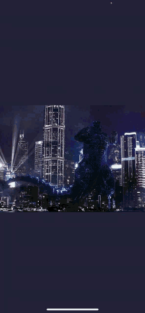 a picture of a monster in front of a city at night