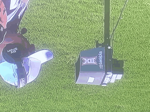 a box with a texas logo on it is on the grass