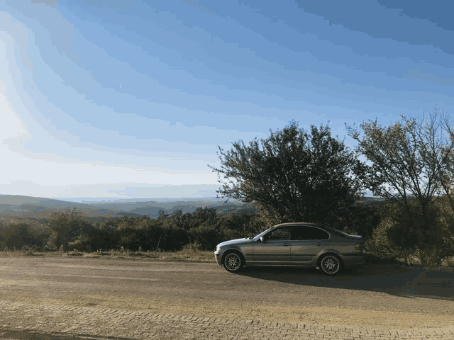 a car is parked on the side of a road