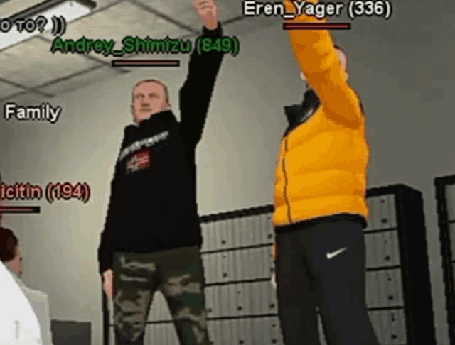 a man in a yellow jacket is raising his fist in the air while standing next to another man