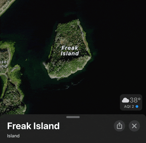 an aerial view of freak island is shown on a phone screen