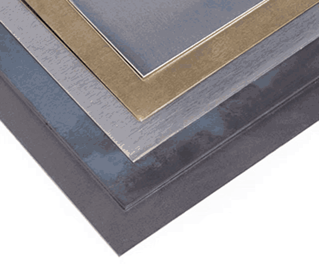 a stack of metal sheets of different sizes and colors