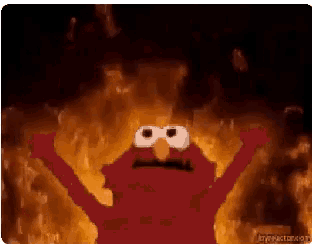 elmo from sesame street is standing in front of a fire with his arms outstretched .