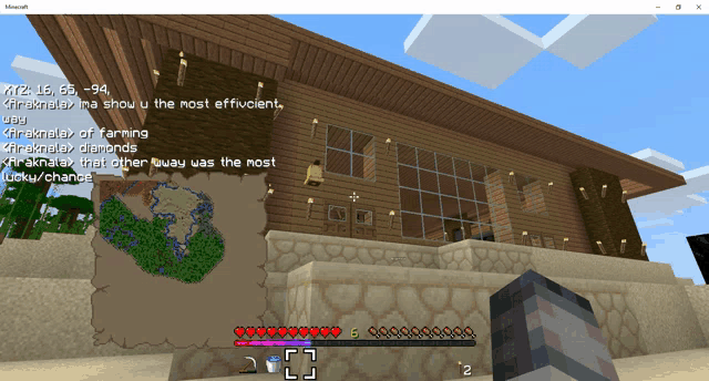 a screenshot of a minecraft game shows a house with a bell on it