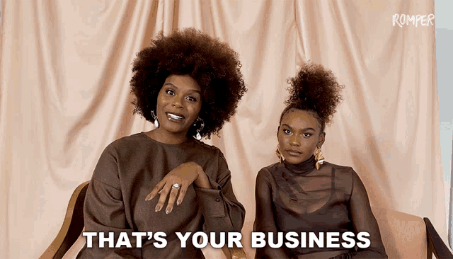 two women sitting next to each other with the words " that 's your business "