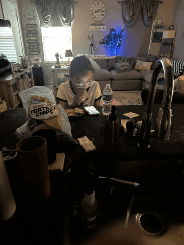 a bag of tortilla chips sits on a kitchen counter