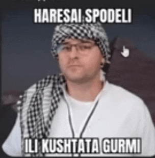 a man wearing a hat and scarf with the words haresai spodeli