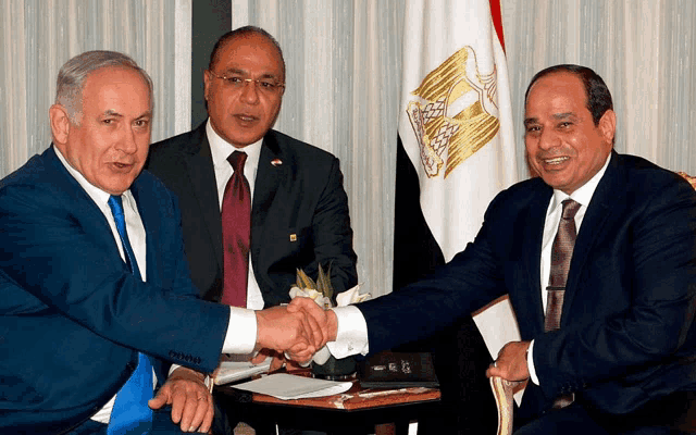 three men shaking hands in front of a flag with a bird on it