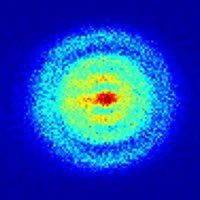 a blue and yellow circle with a red center on a dark blue background .