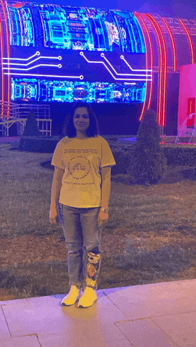 a woman wearing a yellow t-shirt that says ' i 'm sorry ' on it