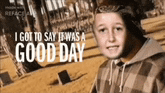 a young boy is standing in a park with the words `` i got to say it was a good day '' written above him .