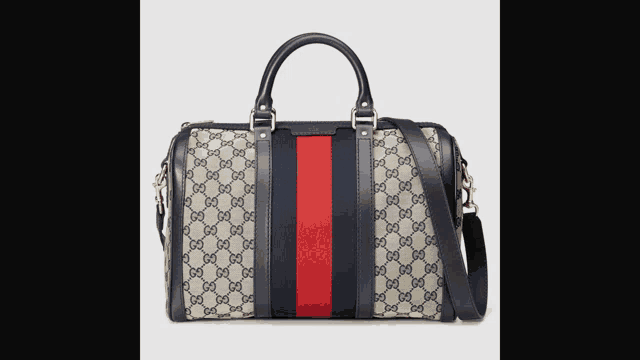 a gucci bag with a red stripe on the side