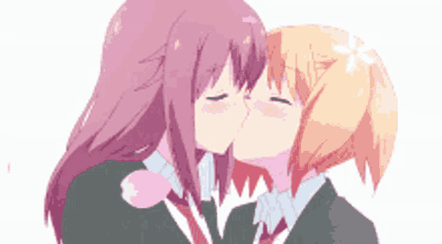 a couple of anime girls kissing each other on the cheek