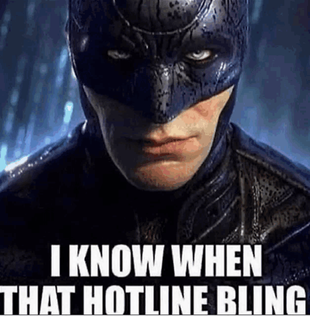 a close up of a man in a batman costume with a caption that says `` i know when that hotline bling ''