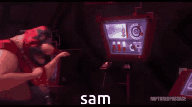 a man is playing a video game in front of a screen that says sam on it .