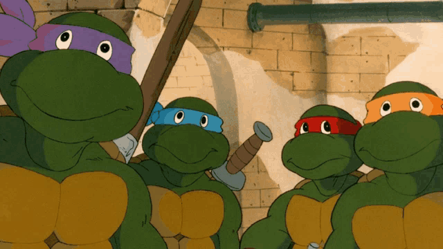 a group of teenage mutant ninja turtles standing together