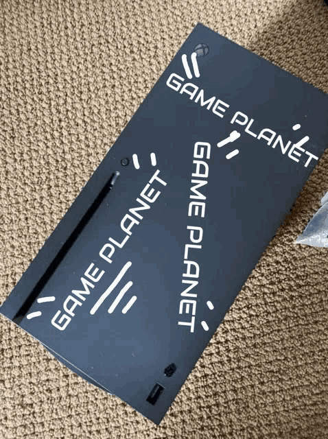 a black box that says game planet on the side