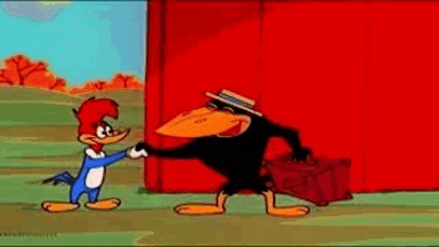 woody woodpecker and a crow are shaking hands in front of a red wall .