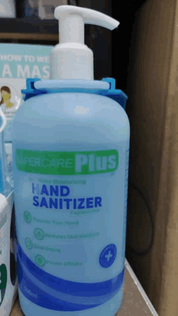 a bottle of safecare plus hand sanitizer sits on a counter