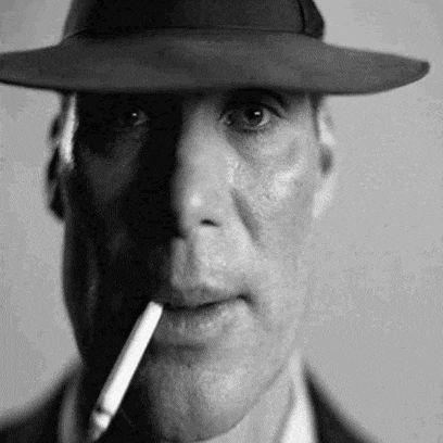 the man is wearing a hat and smoking a cigarette .