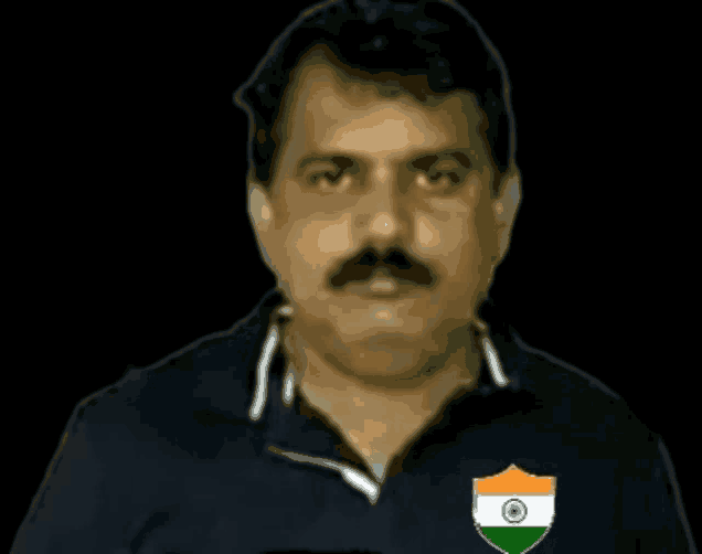 a man with a mustache is wearing a blue shirt with an indian flag emblem on it .