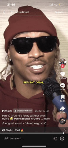 a man wearing sunglasses and a beanie is singing into a microphone on a phone screen