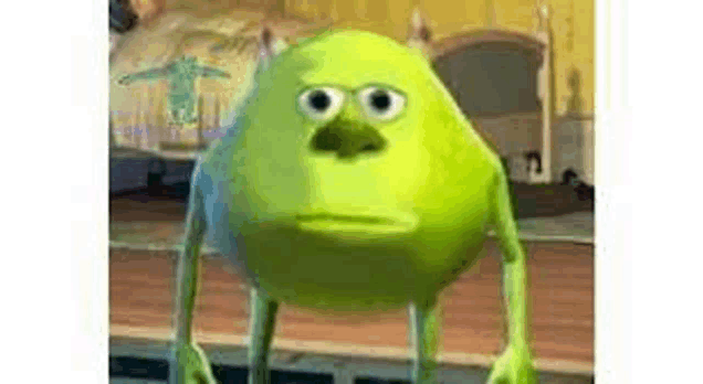 mike wazowski from monsters inc is making a funny face .