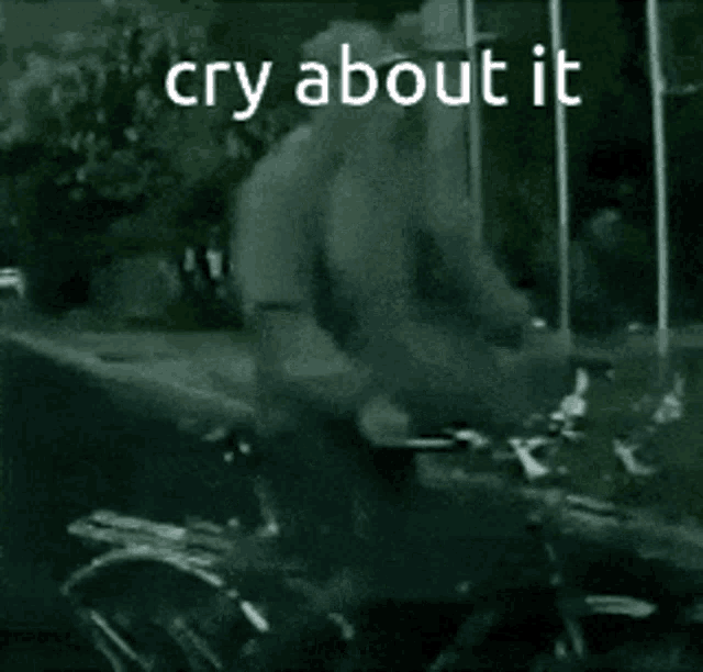 a black and white photo of a person riding a bike with the words cry about it written in white letters .