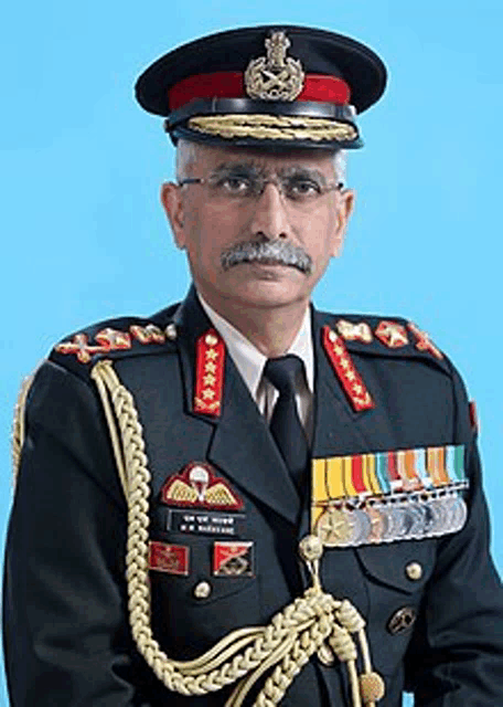 a man in a military uniform has a mustache and a medal around his neck