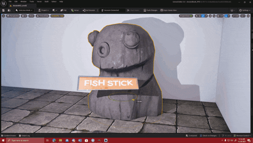 a computer screen shows a statue with a sign that says fish stick on it