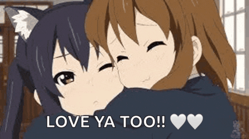 a couple of anime girls hugging each other in a room .