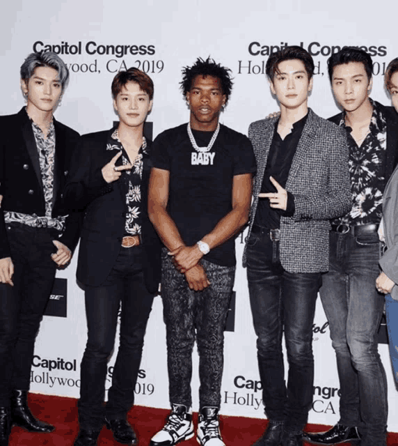 a group of young men are posing for a picture at the capitol congress in hollywood