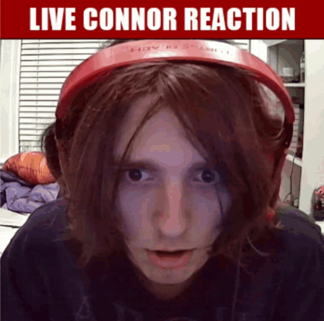 a man wearing red headphones with the words live connor reaction