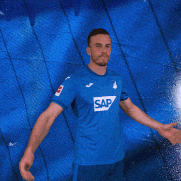 a man in a blue shirt with the word sap on the front