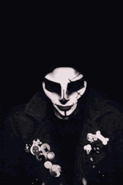 a black and white photo of a person with a skull face paint