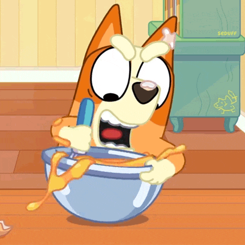 a cartoon dog is holding a spoon in a bowl of food