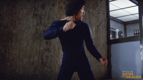 a bruce lee enter the dragon poster shows a man in a blue outfit