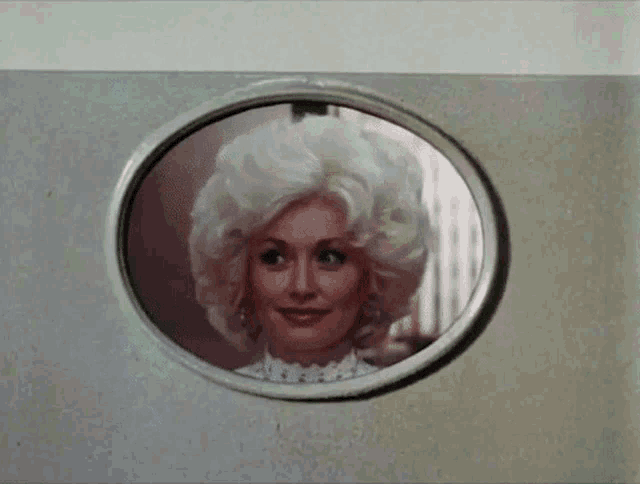 a picture of dolly parton in a round window frame