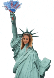 a woman dressed as the statue of liberty is holding a fan and a book