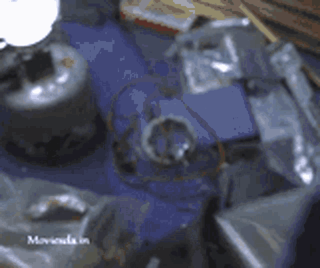 a blurred image of a table with the word moviola in the bottom right corner