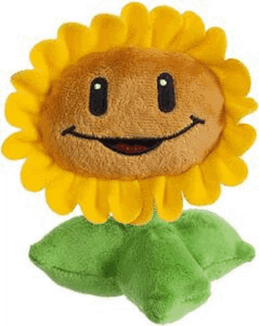 a stuffed sunflower from plants vs zombies with a smiling face and green leaves .