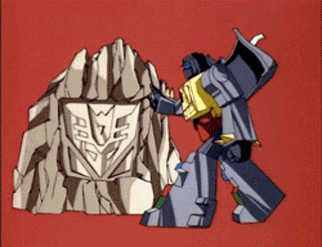 a transformer is standing next to a rock with a shield on it