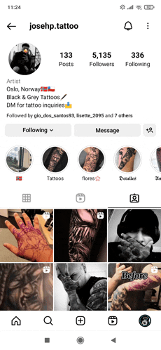 a phone screen shows a tattoo artist 's instagram page