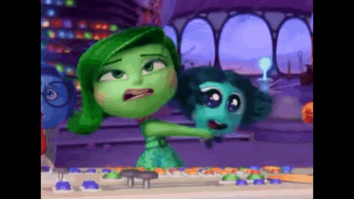 a green cartoon character is standing next to a blue cartoon character in a room .