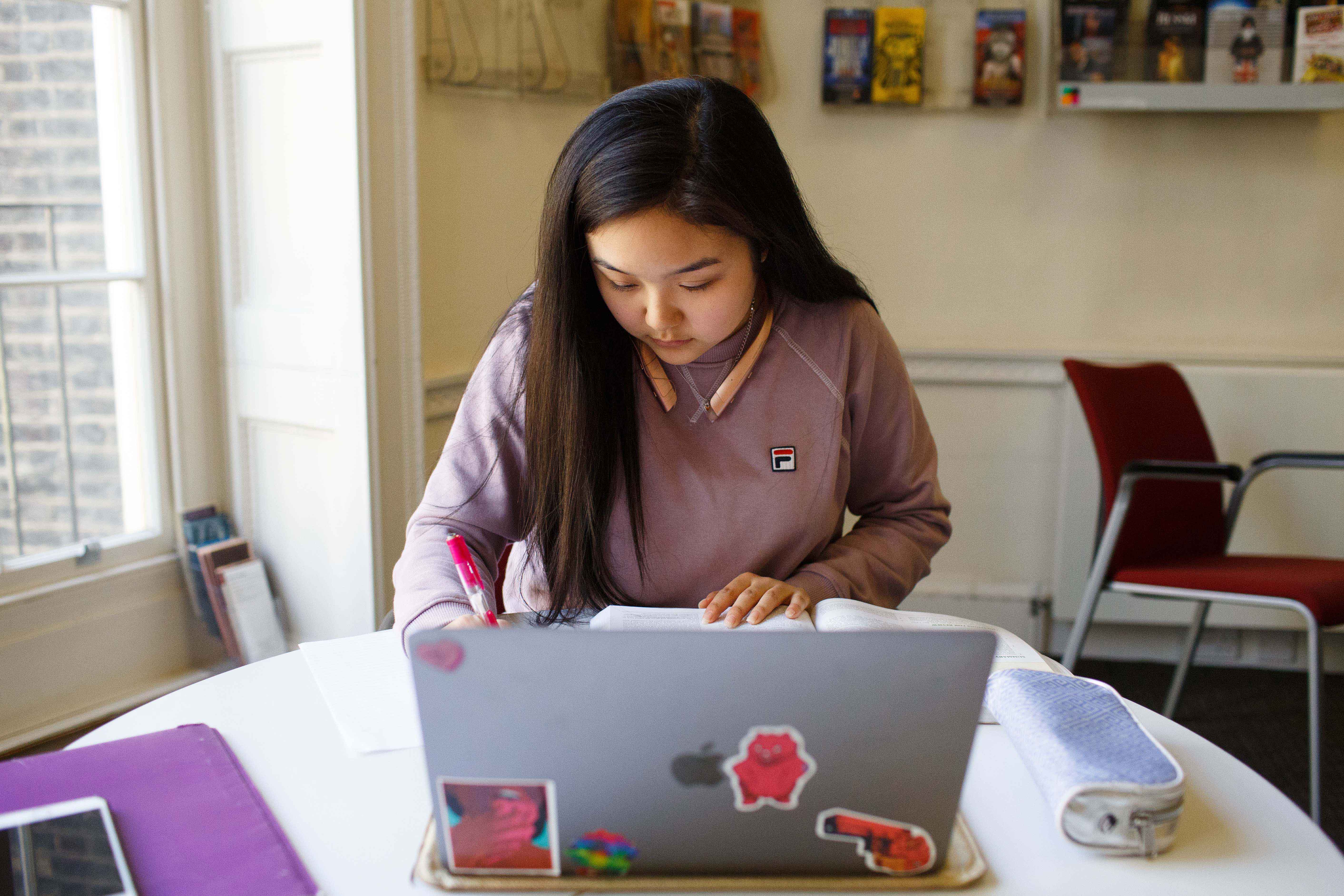 student studying on her laptop