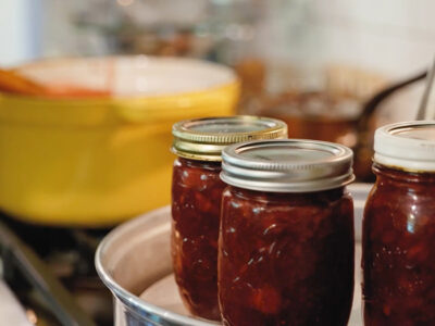 Three jars of jam in a steam canner.