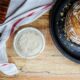 Sourdough loaf of bread and a jar of sourdough starter.